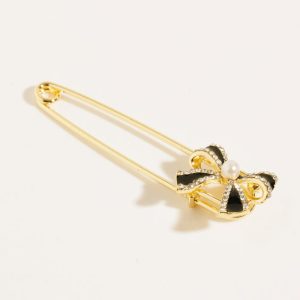 Brosa metalica aurie tip ac cu fundita si pietricele fine albe